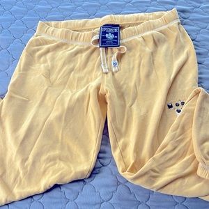 Pink sweatpants size small color yellow.